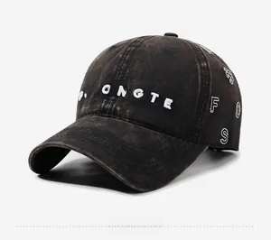 Close-up of vintage washed grey baseball cap featuring high-quality 3D letter embroidery