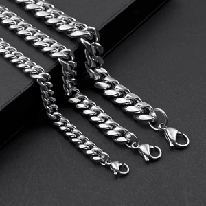 Three assorted widths of silver stainless steel Cuban link chains on black background
