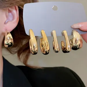 Minimalist chunky gold hoop earrings set with irregular waterdrop shapes and polished finish
