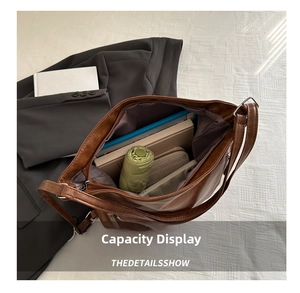 Interior view showing the large capacity of the brown PU leather tote bag with daily items