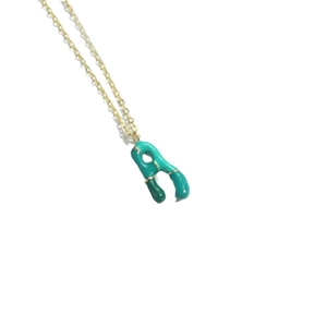 Gold plated necklace with a green enamel puffy letter A balloon pendant on a thin O-chain