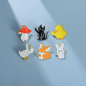 Detailed set of six creative animal enamel pins featuring a cat, fox, and mushroom