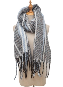 Detailed macro view of the knitted grey scarf with blue stripes and elegant fringe accents