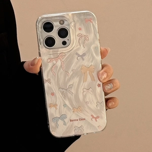 Detail showing colorful ribbon patterns and marble texture on clear iPhone case