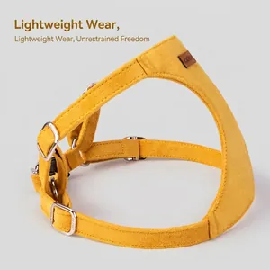 Adjustable bright yellow suede dog harness with secure silver metal buckle for small pets