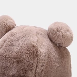 Detail of soft plush bucket hat with cute bear ears and thick faux rabbit fur texture