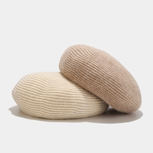 Chic knitted wool beret hats in cream and camel colors with soft ribbed texture