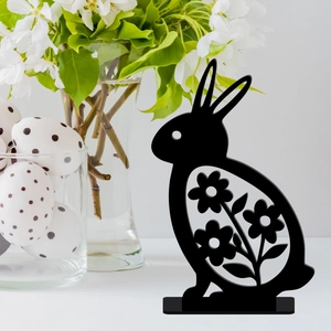 Black acrylic Easter bunny table decor with floral cutouts and white eggs scenery