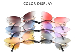 Color display of butterfly wing rimless sunglasses in six gradient shades with metal temples