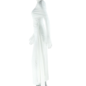 Detail of white one-shoulder maxi dress featuring elegant side ruching and long sleeve