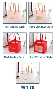Detail of paper gift bags with smiley cut-outs and transparent windows in various colors
