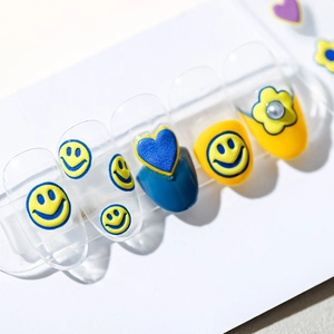 3D embossed nail art stickers featuring yellow smiley faces, blue hearts and flower designs