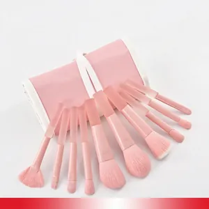 Peach pink 10pcs makeup brush set with soft bristles and matching leather roll-up pouch