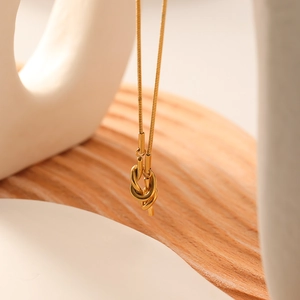 Minimalist 18K gold plated stainless steel knot pendant necklace on snake chain
