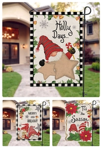 Detail of Christmas garden flags with snowman and gnome prints on linen fabric