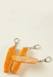 Detailed close-up of PVC fried chicken cutlet keychain showing realistic food texture