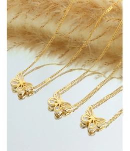 Close-up of butterfly pendants with zircons on 18K gold-plated titanium steel necklaces