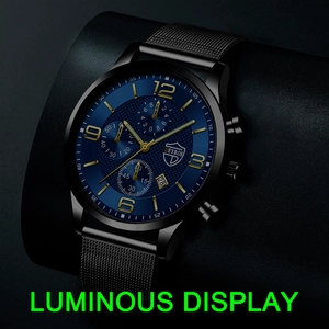 Detail view of the luminous blue diamond-pattern dial and black steel mesh strap