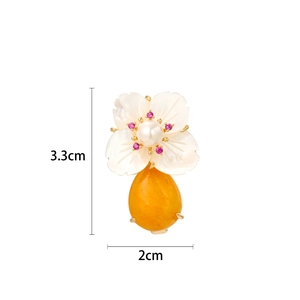 Elegant shell flower brooch with white petals, pearl and yellow teardrop gemstone