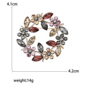 Floral wreath crystal brooch with colorful rhinestones on a gold-tone alloy base