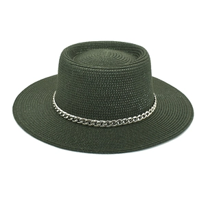 Detail of dark green straw fedora hat featuring a stylish thick silver metal chain band