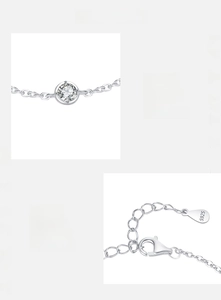 Macro detail of S925 sterling silver chain featuring a round red zircon and S925 hallmark