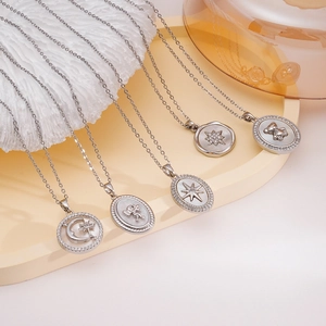 Silver pendant necklaces collection featuring moon, star, bear designs with mother of pearl