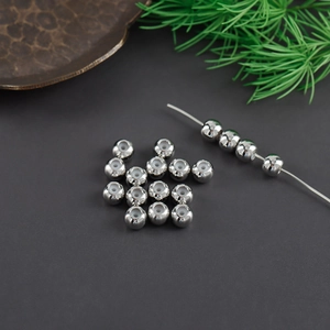 Macro detail of silver beads with silicone cores for secure DIY jewelry positioning