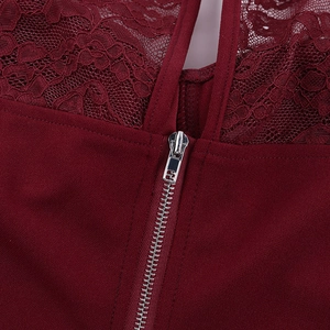 Detail shot of wine red lace stitching and back zipper on this sexy long sleeve top