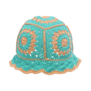 Detailed macro view of handmade crochet cotton bucket hat with sun flower pattern weave