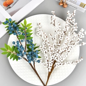 Artificial blue and white berry branches with green leaves for Christmas home decor