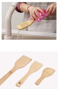 Bamboo spatula set in three sizes being washed under water in a home kitchen