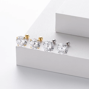 Detailed close-up of S925 sterling silver four-prong stud earrings with cubic zirconia