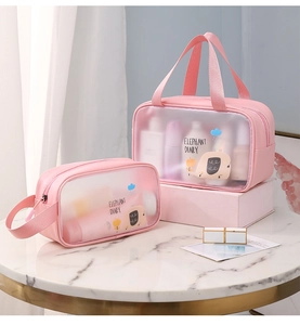 Detail view of two pink cartoon elephant PVC waterproof makeup bags in different sizes