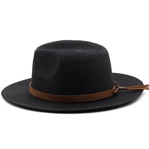 Detailed view of black woven straw hat featuring a textured brown band with drawstring