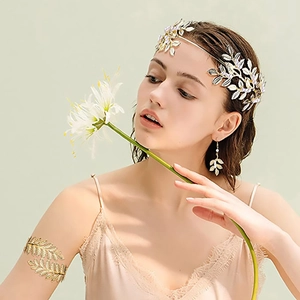 Detailed view of Greek style gold and silver leaf headband earrings and arm cuff set