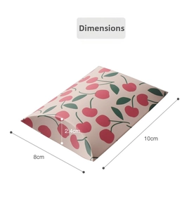 Detail view of pink cherry print pillow gift box with 10cm x 8cm x 2.4cm size specs