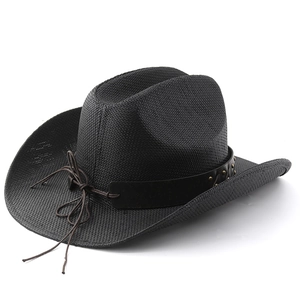 Detail of black straw cowboy hat featuring studded leather band and woven texture