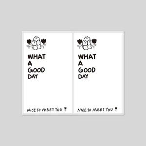 Detail showing minimalist white decorative cards with What a Good Day printed text