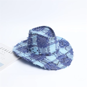 Blue patchwork denim cowboy hat with fringe edges and bohemian western style detailing