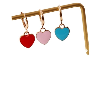 Colorful heart drop earrings in red, pink and blue with gold metal hoop buckles