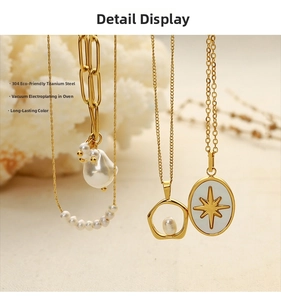 Detailed macro view showing vacuum-plated 18k gold pendants with baroque pearls and star motifs