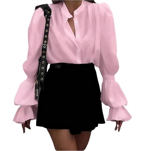 Close-up of pink blouse showing lantern sleeves and elegant button-down collar details