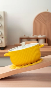 Detail of yellow daisy silicone mat showing anti-slip design on a 45-degree slope