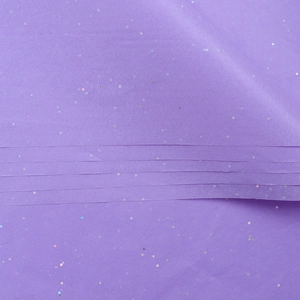 Detailed view of purple pearlescent tissue paper with shimmering glitter and sequins