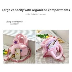 Detail view of pink plush cat bag interior with smooth zipper and smartphone storage space