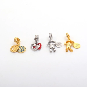 Detailed close-up of fashion DIY charms featuring heart, scarecrow and Love Guard motifs