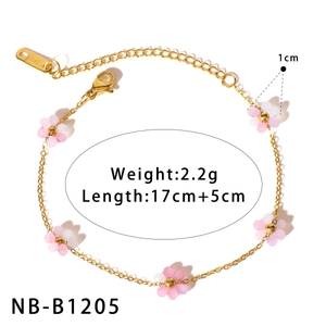 Detail of gold stainless steel flower bracelet with pink floral charms and measurements