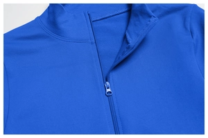 Detail of royal blue yoga jacket featuring breathable mesh fabric and seamless half-zipper