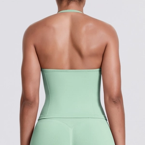 Detailed back view of a mint green seamless sports tank top with backless halter design